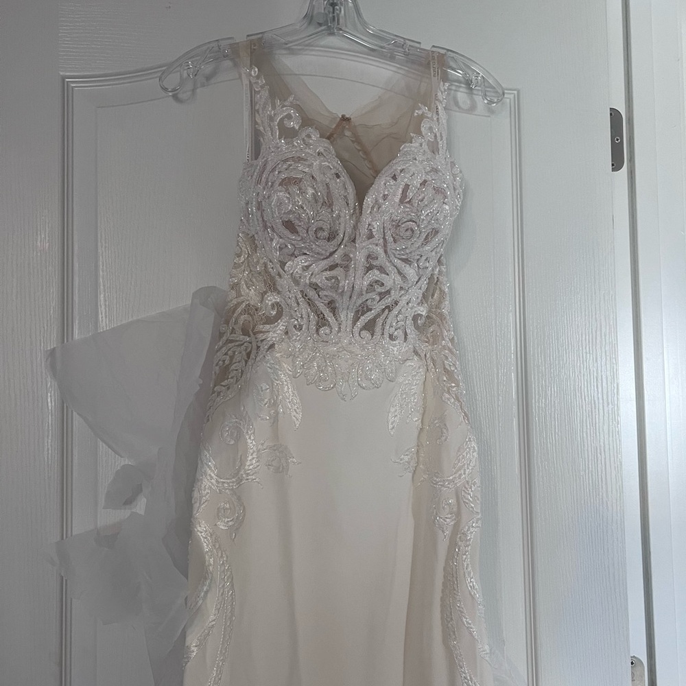 Brand new designer wedding dress, never altered, size 10